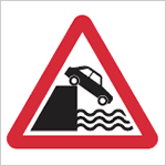 Quayside or river bank road sign