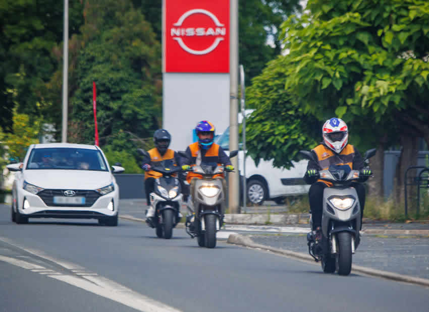 Motorcycle riders on a riding test